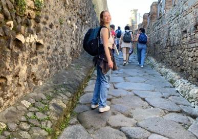 Quinn Christensen standing in a street way in Florence, Italy 